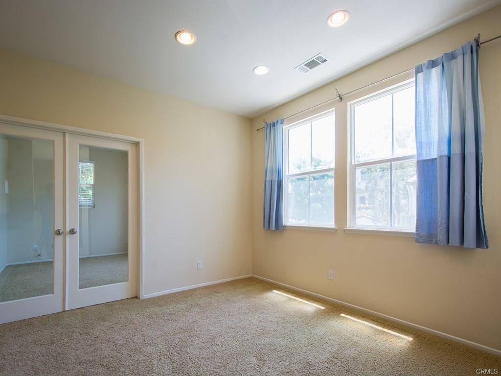 7 Silvermaple Irvine, CA 92618 - Photo 6 of 21 an empty room with a empty space and windows