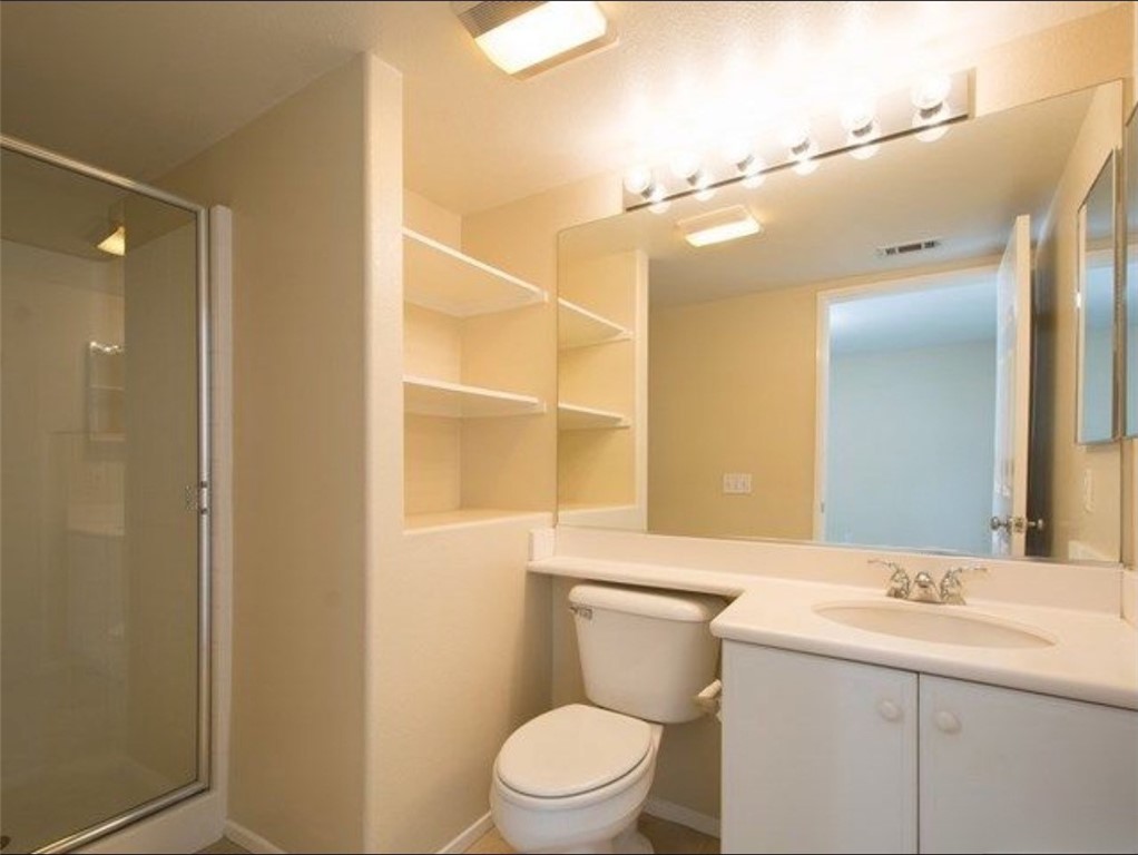 7 Silvermaple Irvine, CA 92618 - Photo 7 of 21 a bathroom with a toilet a sink and mirror