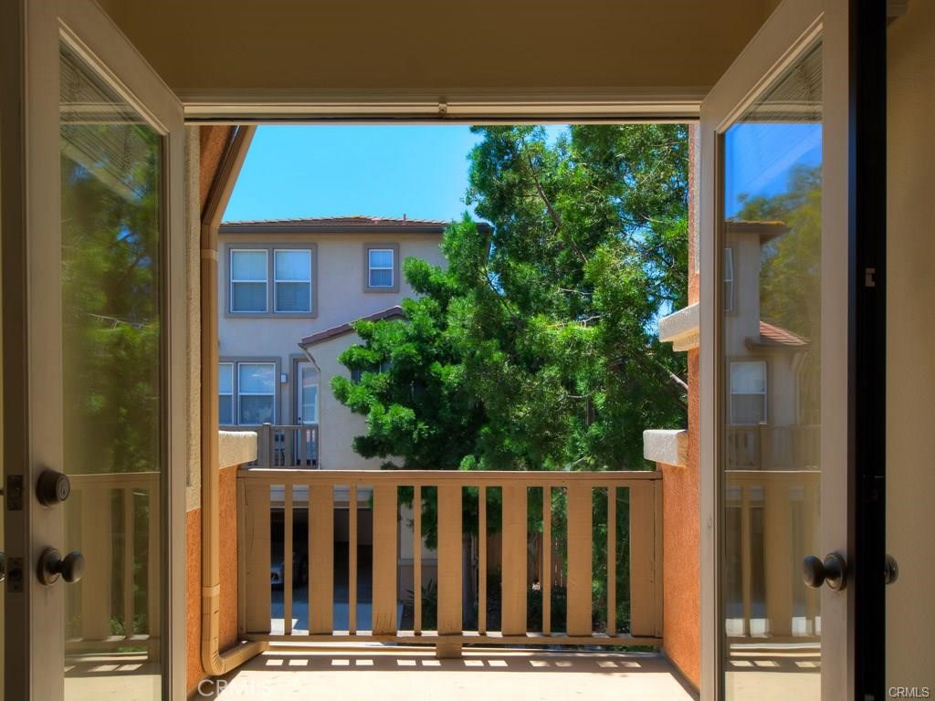 7 Silvermaple Irvine, CA 92618 - Photo 9 of 21 a view of balcony with wooden floor