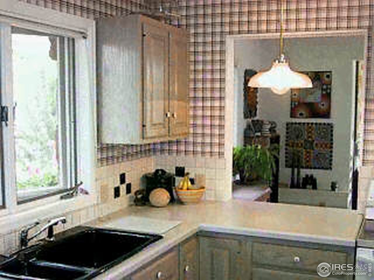 117 Apple Ridge Road Lyons, CO 80540 - Photo 3 of 11 a kitchen with a sink and a window