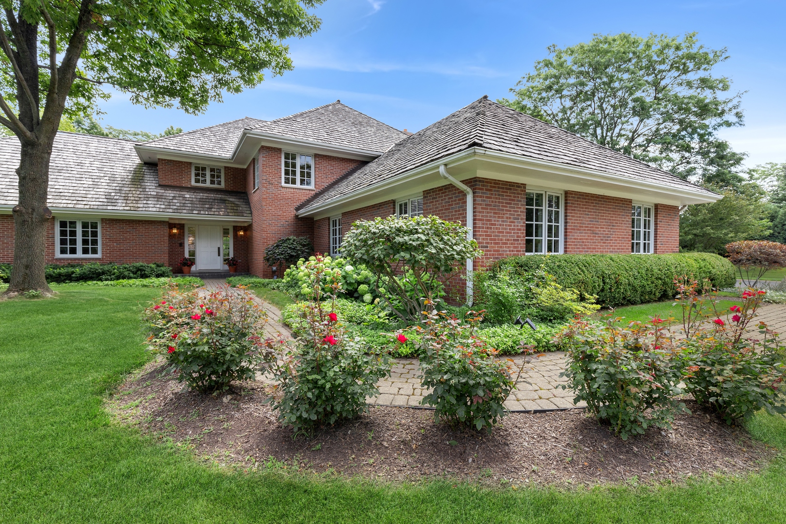a front view of a house with a yard