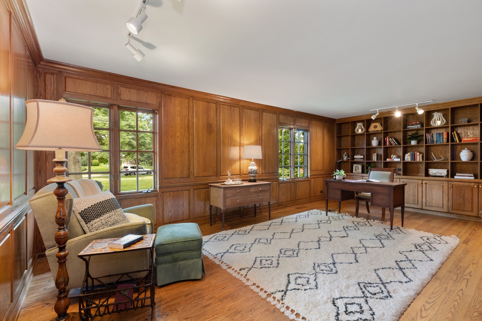 390 South Basswood Road Lake Forest, IL 60045 - Photo 14 of 38 a living room with furniture a lamp and a large window