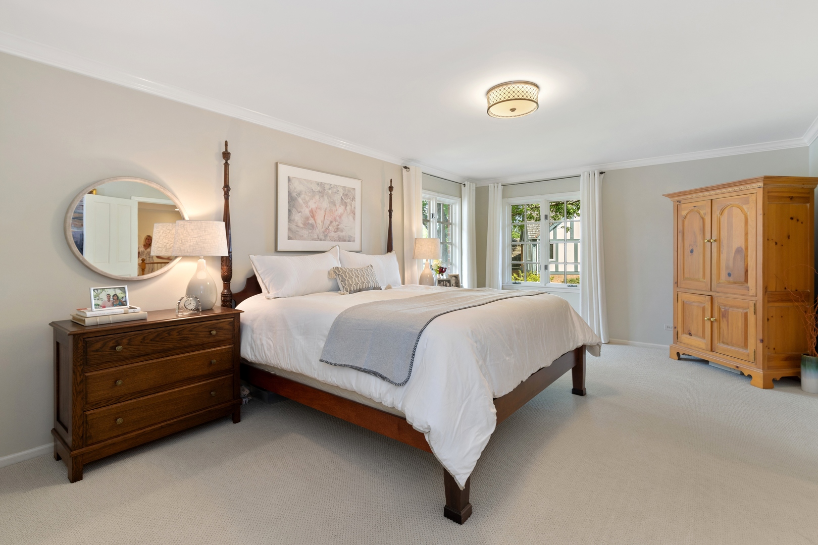 390 South Basswood Road Lake Forest, IL 60045 - Photo 16 of 38 a spacious bedroom with a bed a dresser and large window
