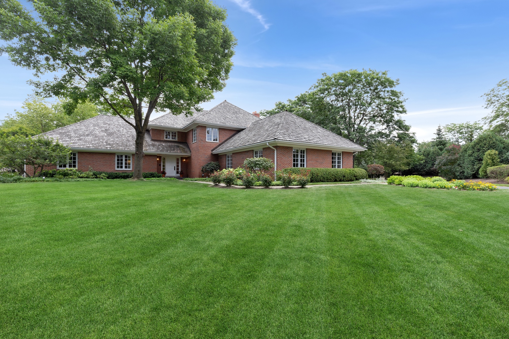 390 South Basswood Road Lake Forest, IL 60045 - Photo 3 of 38 a front view of a house with garden