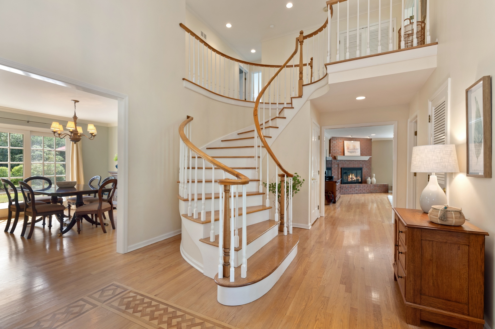 390 South Basswood Road Lake Forest, IL 60045 - Photo 4 of 38 a view of a hallway with wooden floor table and chairs