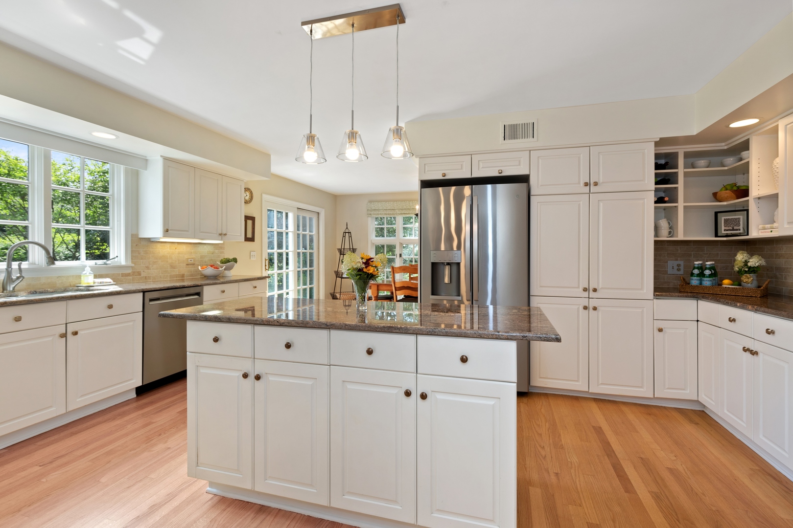 390 South Basswood Road Lake Forest, IL 60045 - Photo 9 of 38 a kitchen with stainless steel appliances a refrigerator sink and cabinets