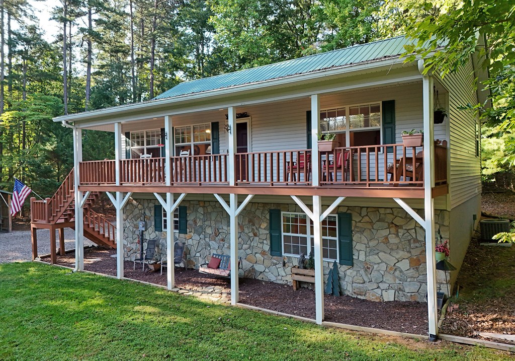 31 Lance Crossing Road Blairsville, GA 30512 - Photo 15 of 52 a view of a house with a yard porch and furniture