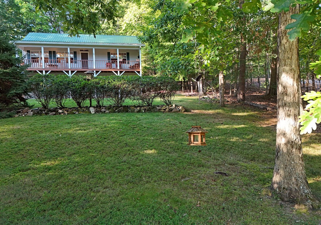 31 Lance Crossing Road Blairsville, GA 30512 - Photo 16 of 52 a view of a house with a yard and sitting area