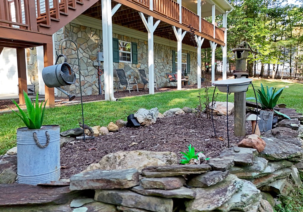 31 Lance Crossing Road Blairsville, GA 30512 - Photo 20 of 52 a view of a chair and tables in backyard