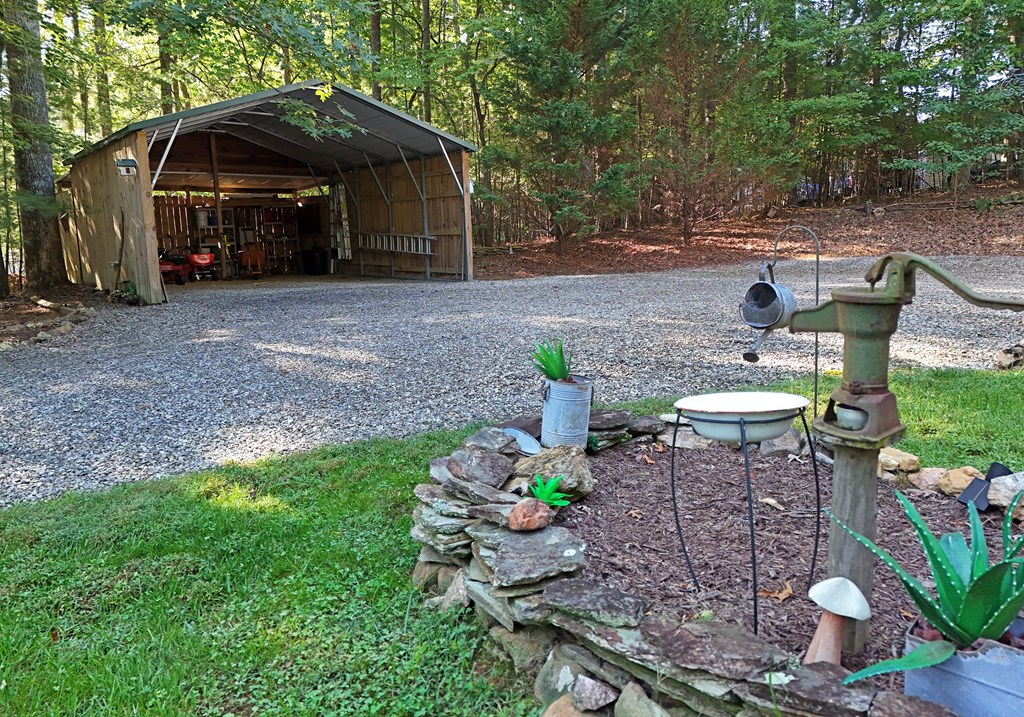 31 Lance Crossing Road Blairsville, GA 30512 - Photo 22 of 52 a view of a chair and table in backyard of the house