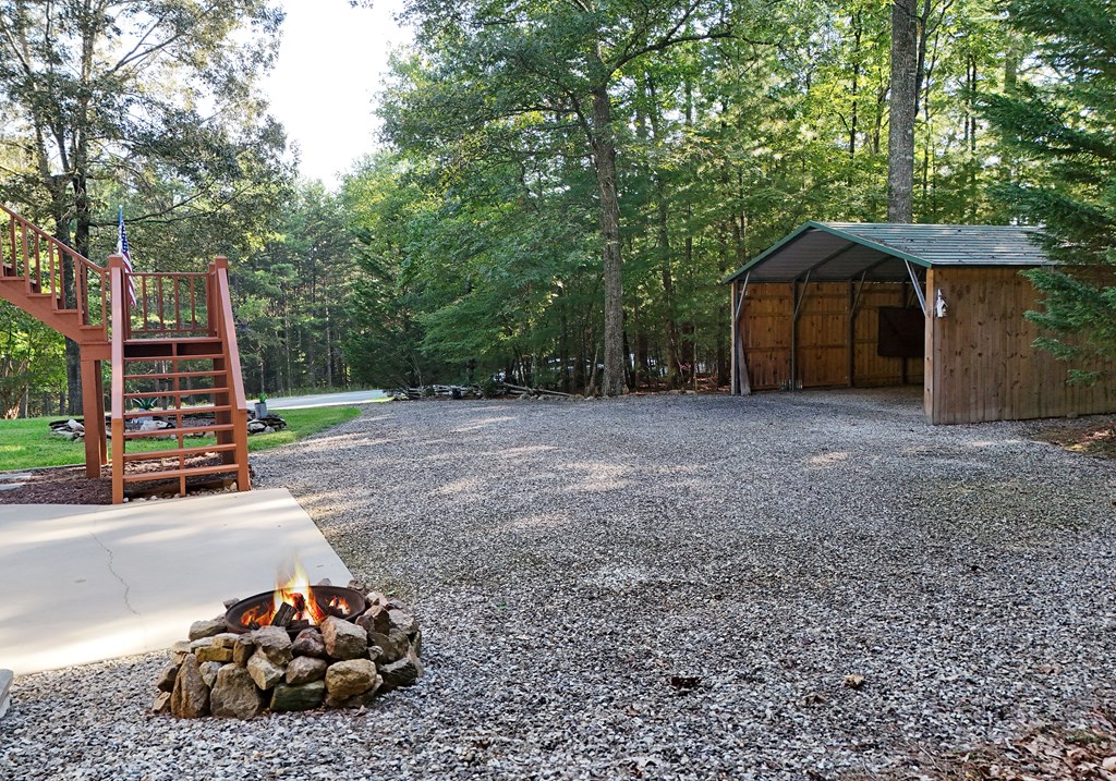 31 Lance Crossing Road Blairsville, GA 30512 - Photo 24 of 52 a view of backyard with wooden fence and a bench