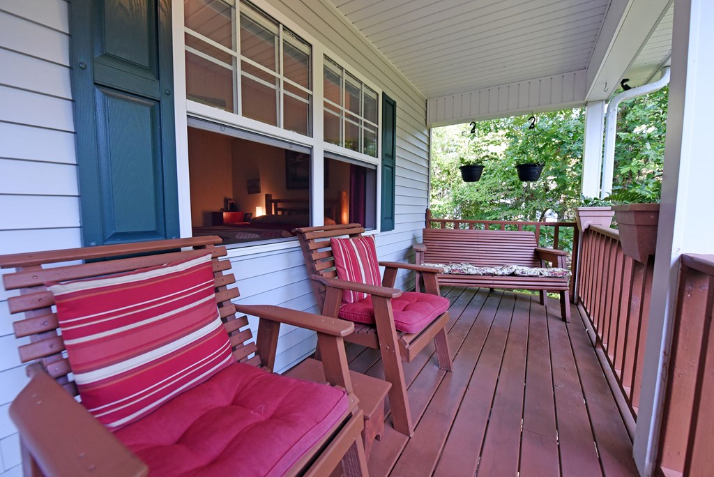 31 Lance Crossing Road Blairsville, GA 30512 - Photo 33 of 52 a backyard of a house with wooden floor table and chairs