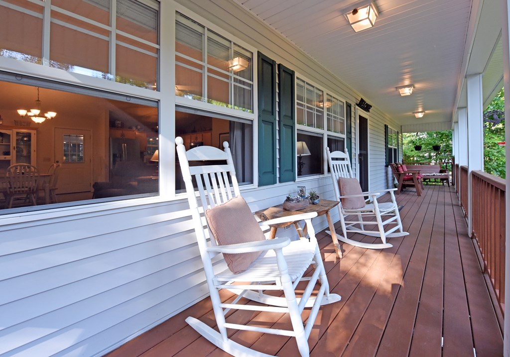 31 Lance Crossing Road Blairsville, GA 30512 - Photo 35 of 52 a view of a patio with table and chairs with wooden floor and fence
