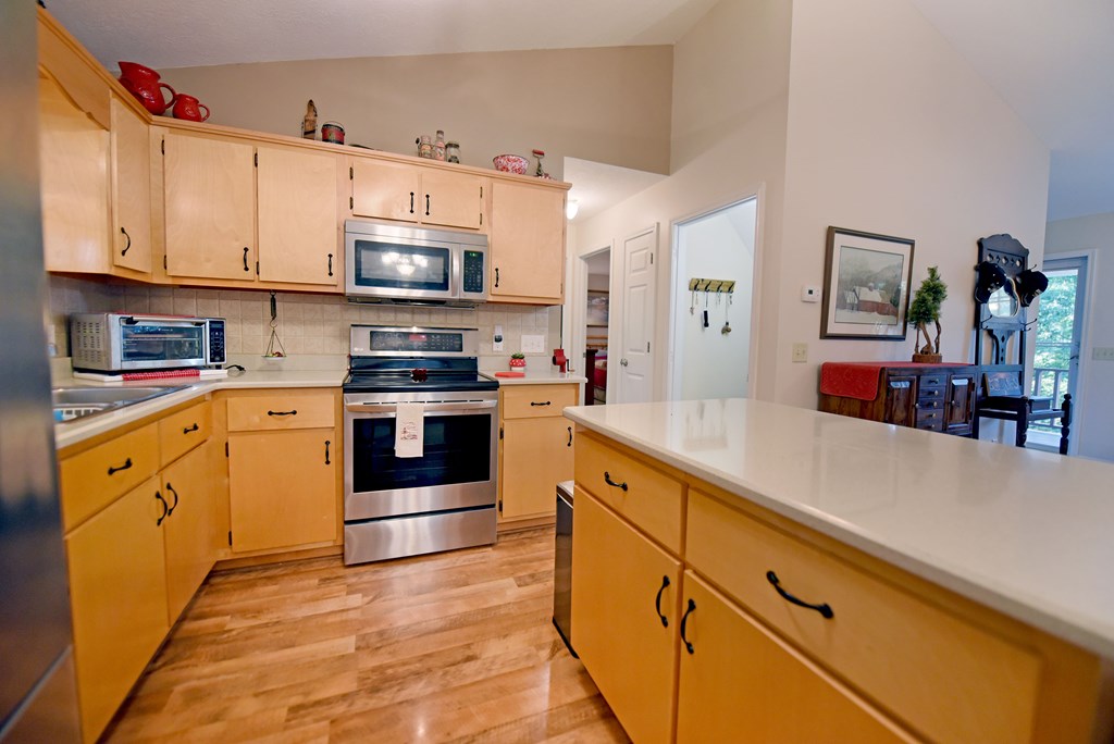 31 Lance Crossing Road Blairsville, GA 30512 - Photo 39 of 52 a kitchen with stainless steel appliances granite countertop a stove and a sink