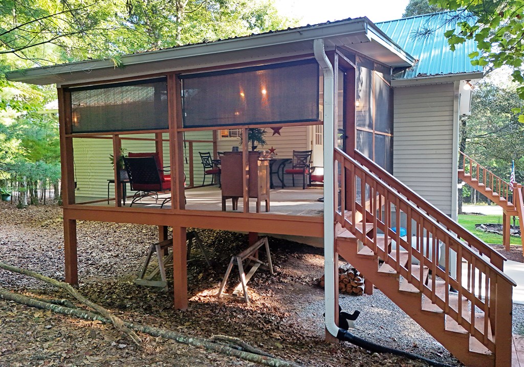 31 Lance Crossing Road Blairsville, GA 30512 - Photo 4 of 52 a view of a chairs setting on the deck