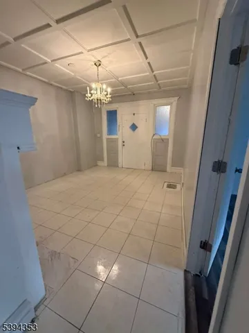 a view of a hallway with a chandelier