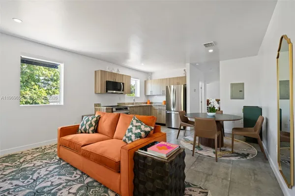 a bedroom with furniture and a flat screen tv