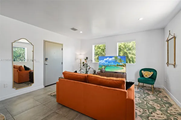 a living room with furniture and a window