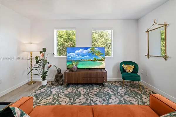 a living room with furniture and a window