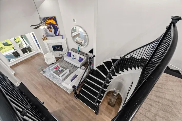 a bedroom with furniture and wooden floor