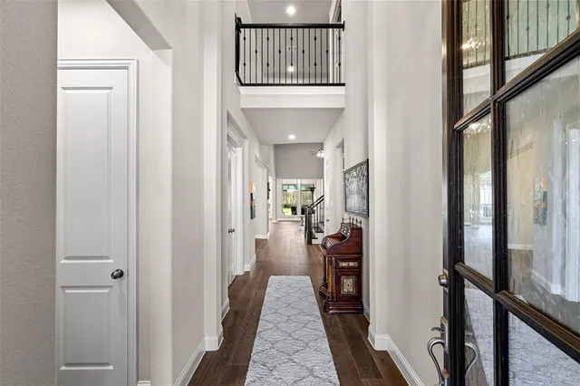 a view of entryway with wooden floor and stairs