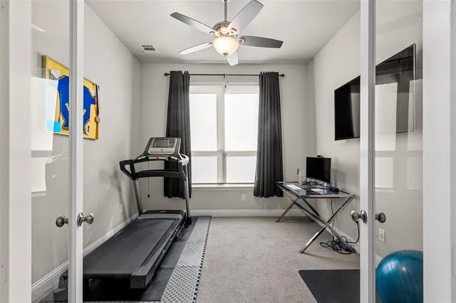 a view of a patio with a table and chairs