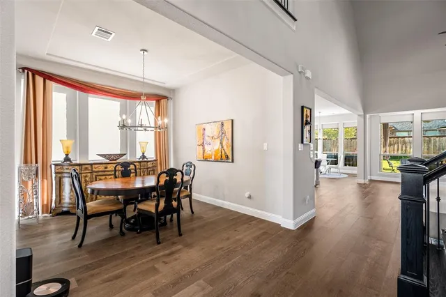 a living room with furniture kitchen view and a fireplace