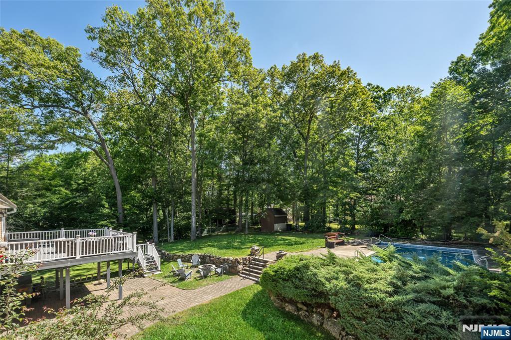 21 Marcia Road Ringwood, NJ 07456 - Photo 37 of 42 a view of backyard with a table and chairs