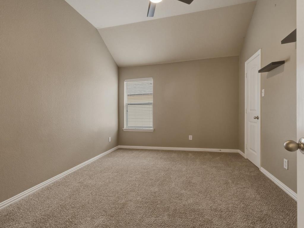 2364 Ranchview Drive Little Elm, TX 75068 - Photo 29 of 33 Vaulted ceiling, ceiling fan, neutral carpet flooring