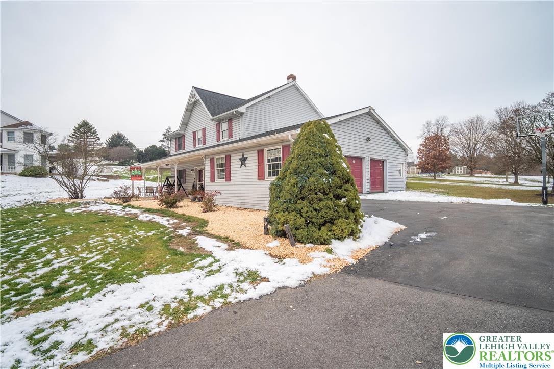 3955 Coplay Creek Road Schnecksville, PA 18078 - Photo 2 of 34 a front view of a house with a yard and potted plants