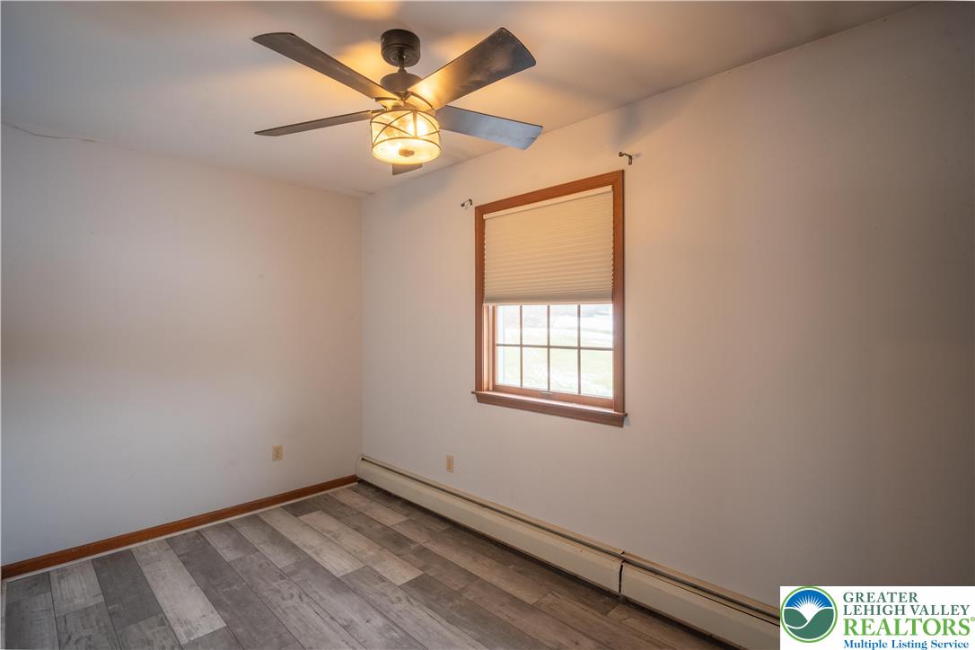 3955 Coplay Creek Road Schnecksville, PA 18078 - Photo 22 of 34 an empty room with windows and fan