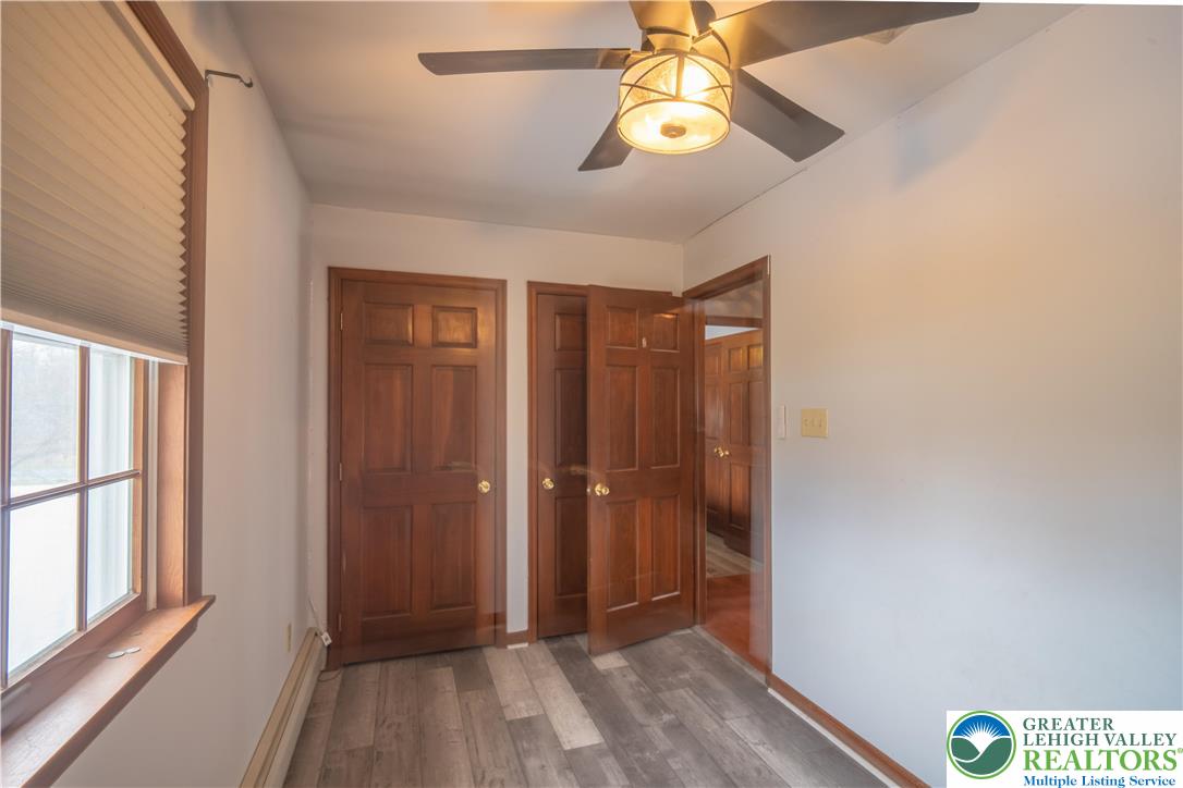 3955 Coplay Creek Road Schnecksville, PA 18078 - Photo 23 of 34 a view of hallway with a large window and chandelier fan
