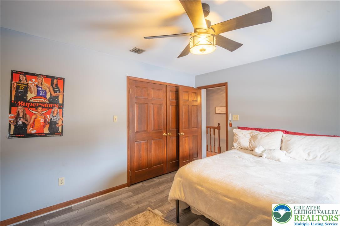 3955 Coplay Creek Road Schnecksville, PA 18078 - Photo 25 of 34 a bedroom with a bed and a chandelier