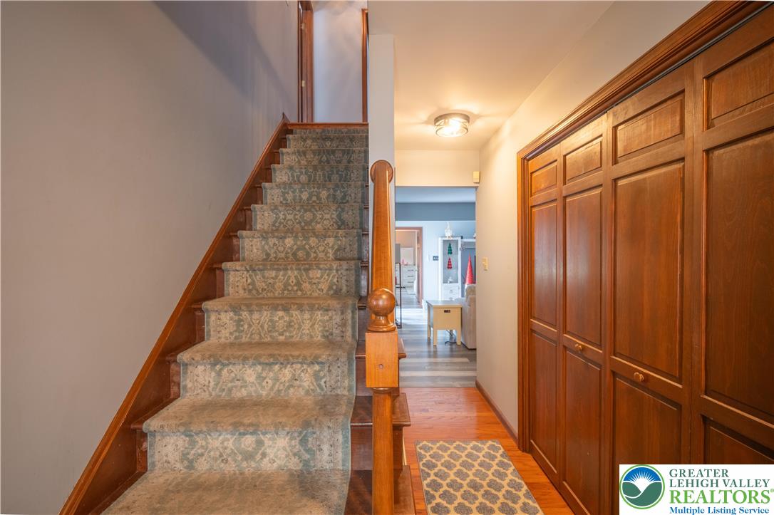 3955 Coplay Creek Road Schnecksville, PA 18078 - Photo 28 of 34 a view of a hallway with wooden floor and staircase