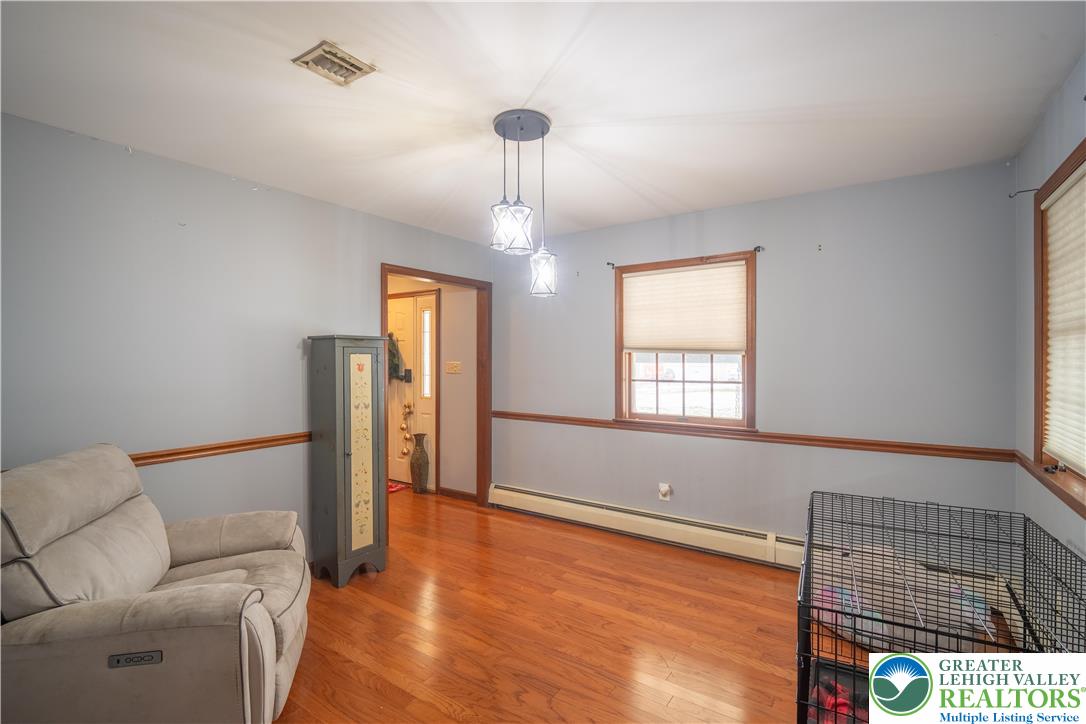 3955 Coplay Creek Road Schnecksville, PA 18078 - Photo 6 of 34 a living room with furniture and a chandelier