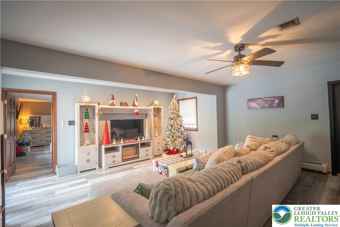 3955 Coplay Creek Road Schnecksville, PA 18078 - Photo 10 of 34 a living room with furniture and a chandelier