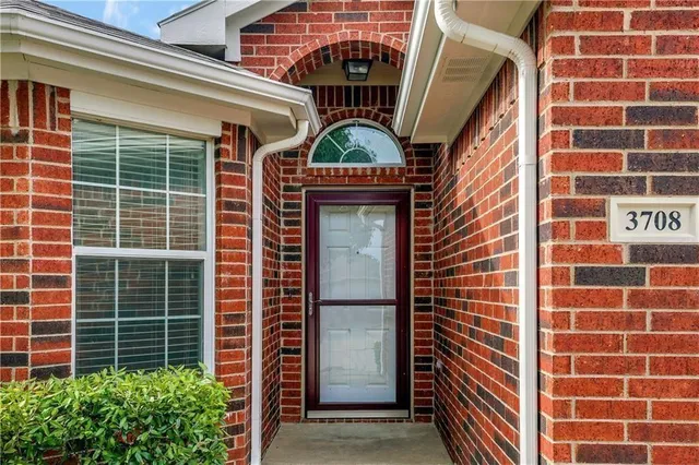 a kitchen with stainless steel appliances granite countertop a stove oven and a refrigerator