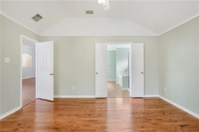a bathroom with a tub a sink and mirror