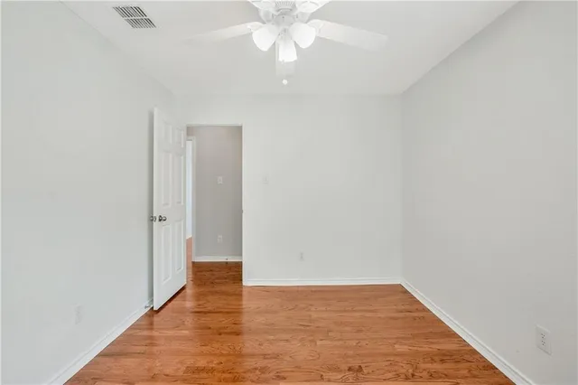 a view of swimming pool with a lounge chairs