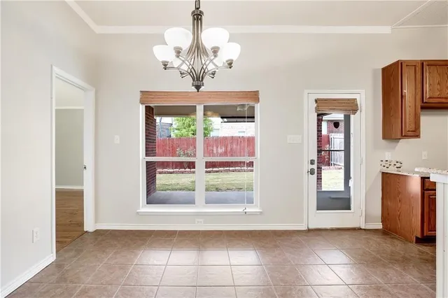 a view of a kitchen with a fridge wooden floor and a window