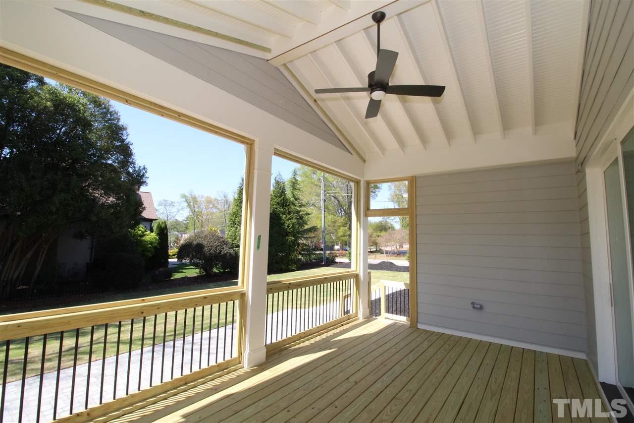 512 Manchester Drive Raleigh, NC 27609 - Photo 8 of 21 a view of a porch with wooden floor and outdoor space