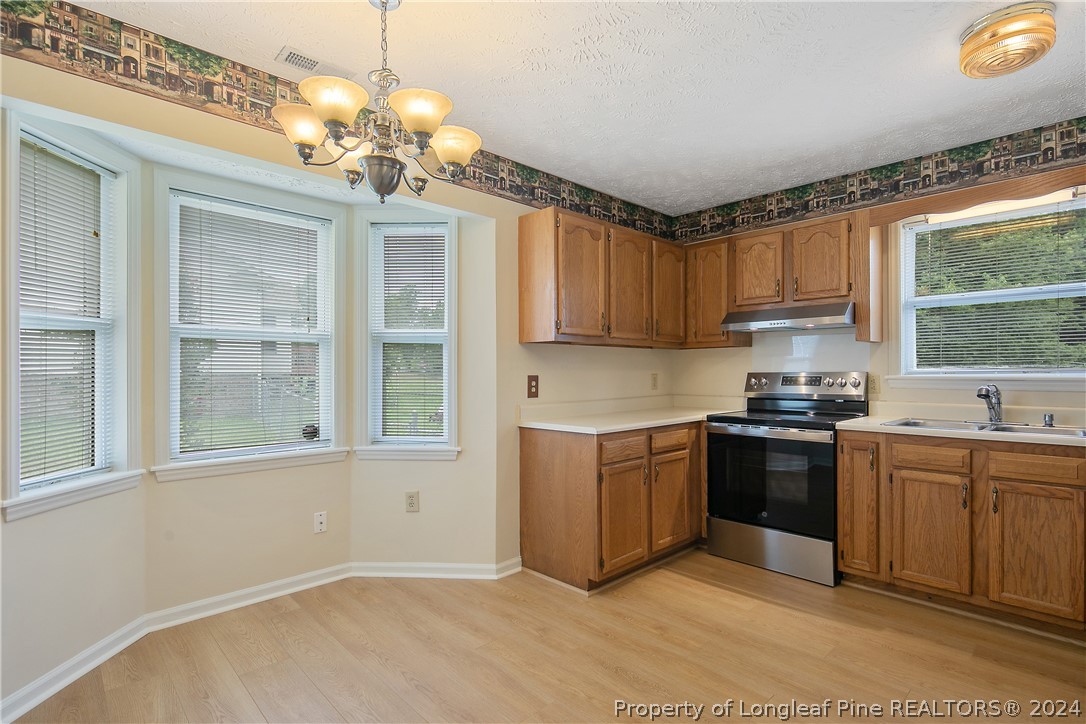 51 Overlook Road Cameron, NC 28326 - Photo 15 of 40 a kitchen with a sink stove and microwave