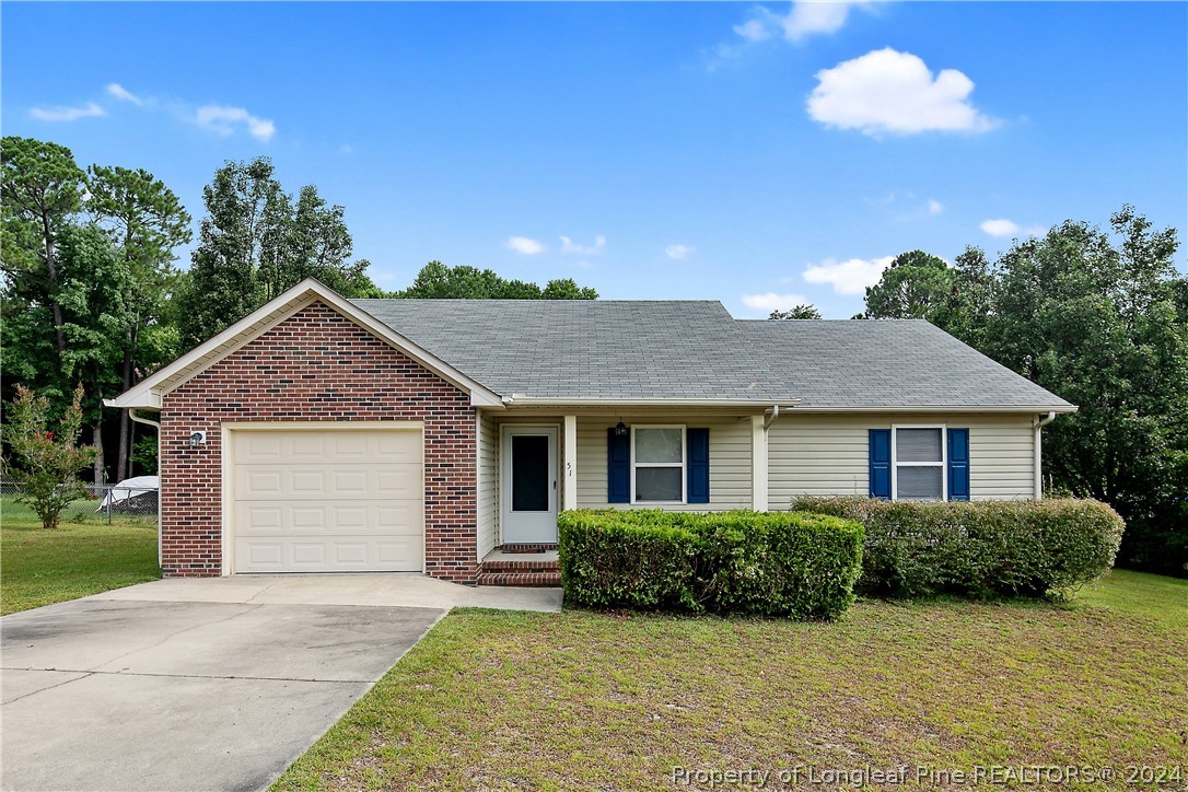 51 Overlook Road Cameron, NC 28326 - Photo 2 of 40 a front view of a house with yard and green space