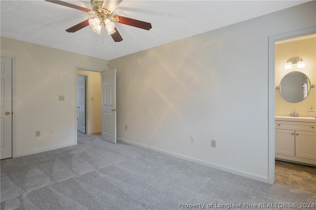 51 Overlook Road Cameron, NC 28326 - Photo 22 of 40 an empty room with chandelier fan