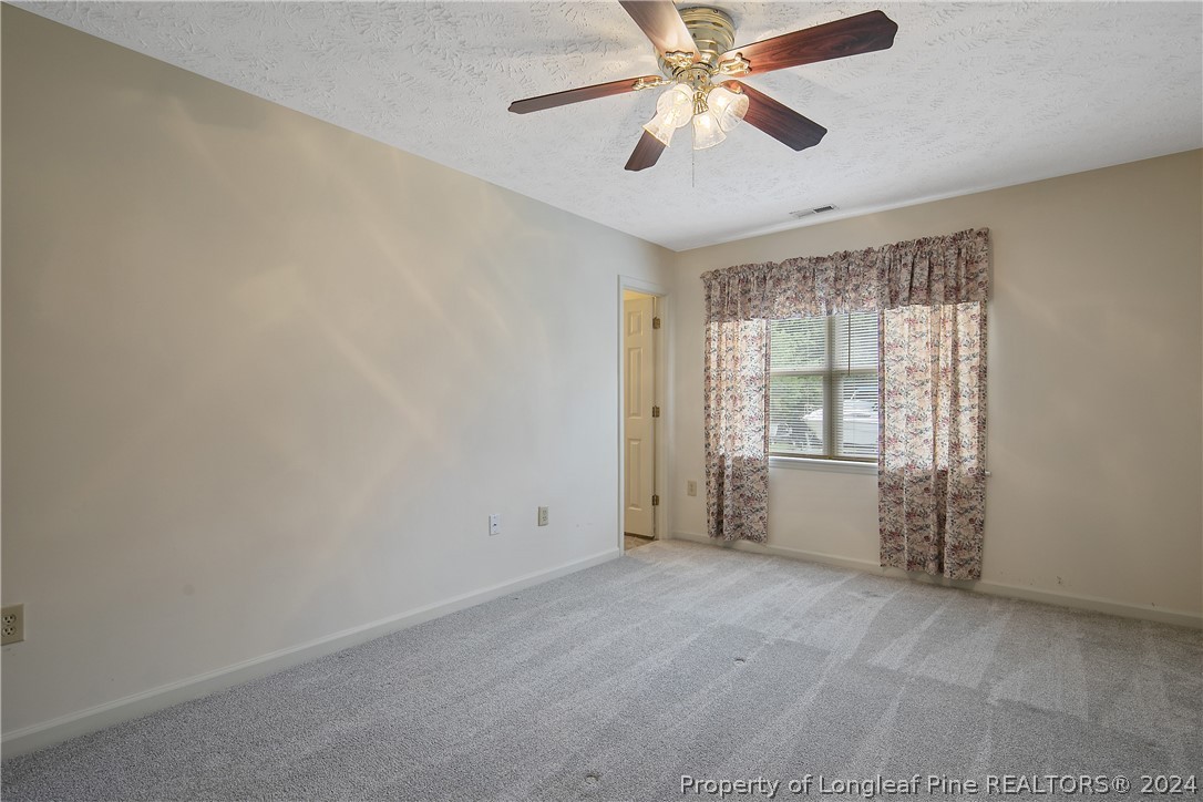 51 Overlook Road Cameron, NC 28326 - Photo 23 of 40 an empty room with windows and fan