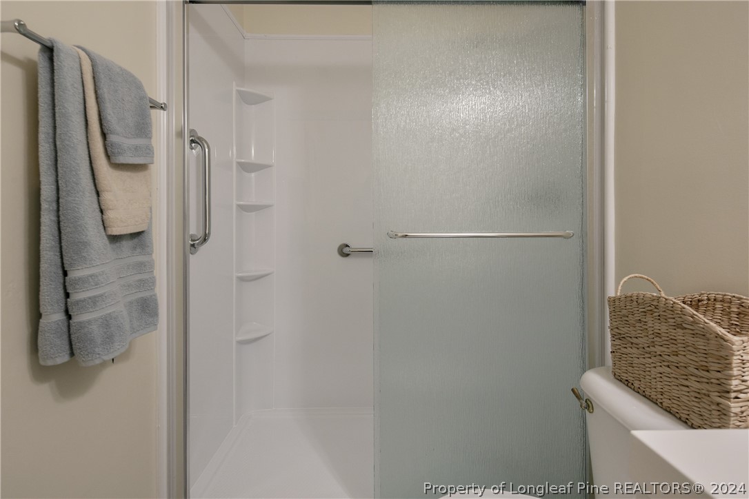 51 Overlook Road Cameron, NC 28326 - Photo 26 of 40 a bathroom with a granite countertop shower and a sink