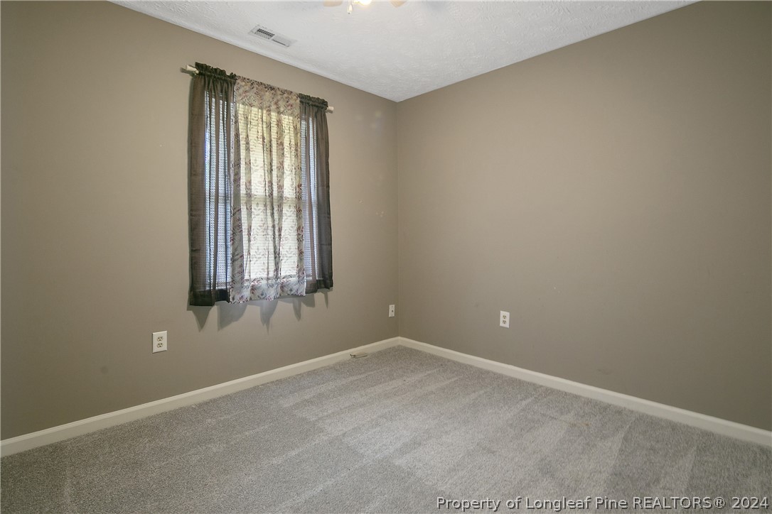 51 Overlook Road Cameron, NC 28326 - Photo 27 of 40 an empty room with windows