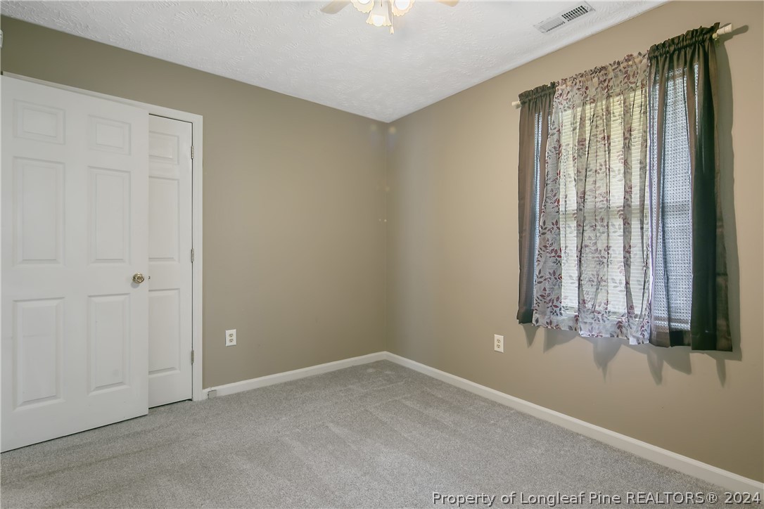 51 Overlook Road Cameron, NC 28326 - Photo 30 of 40 an empty room with a window