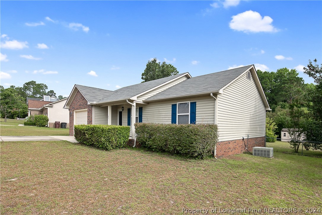 51 Overlook Road Cameron, NC 28326 - Photo 3 of 40 a front view of a house with a yard