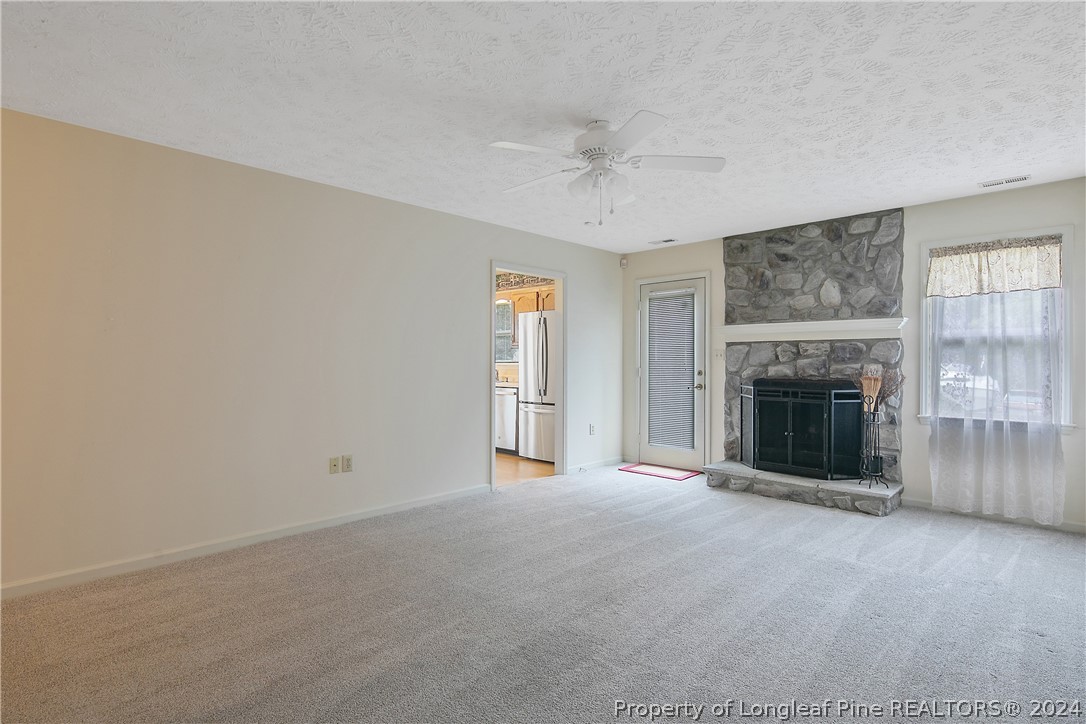 51 Overlook Road Cameron, NC 28326 - Photo 10 of 40 wooden floor and fireplace in an empty room